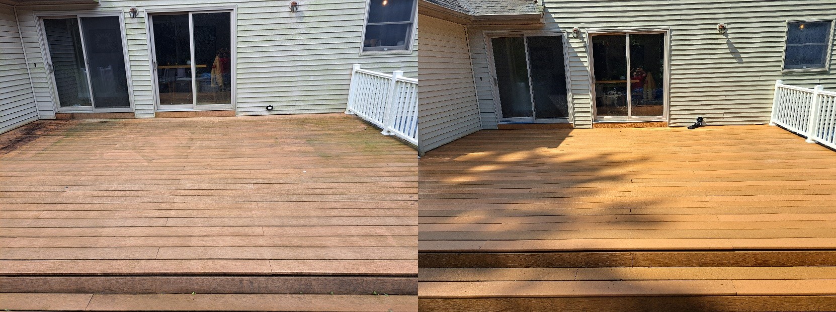 Newly stained wooden deck adjacent to residential homes with white railings and sliding glass doors